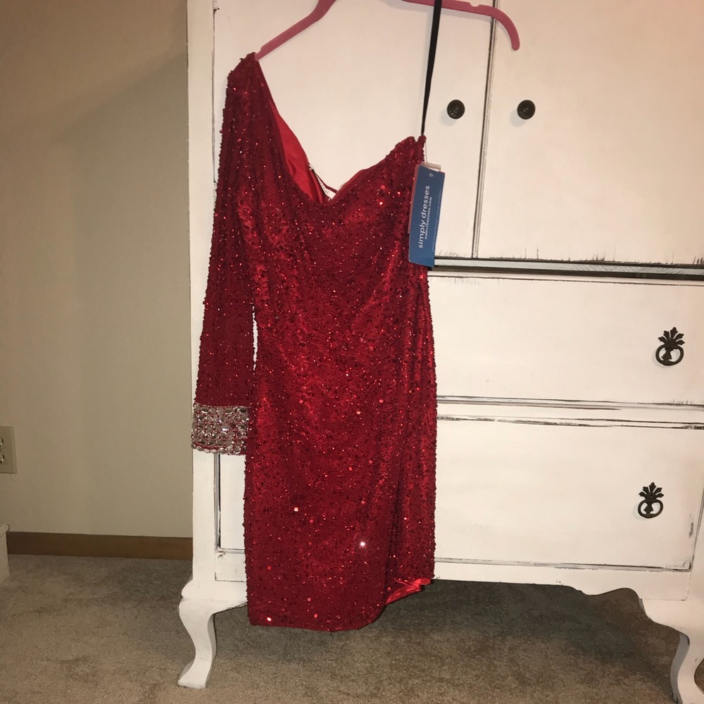 Sequined one shouldered formal dress.